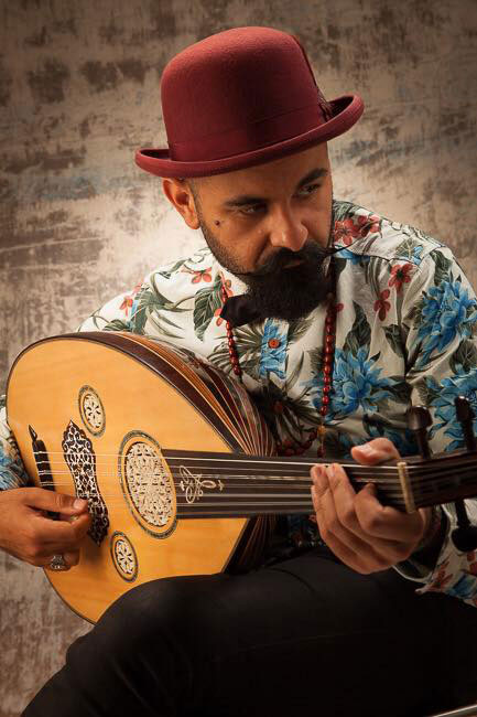 Joseph Tawadros wearing a red hat